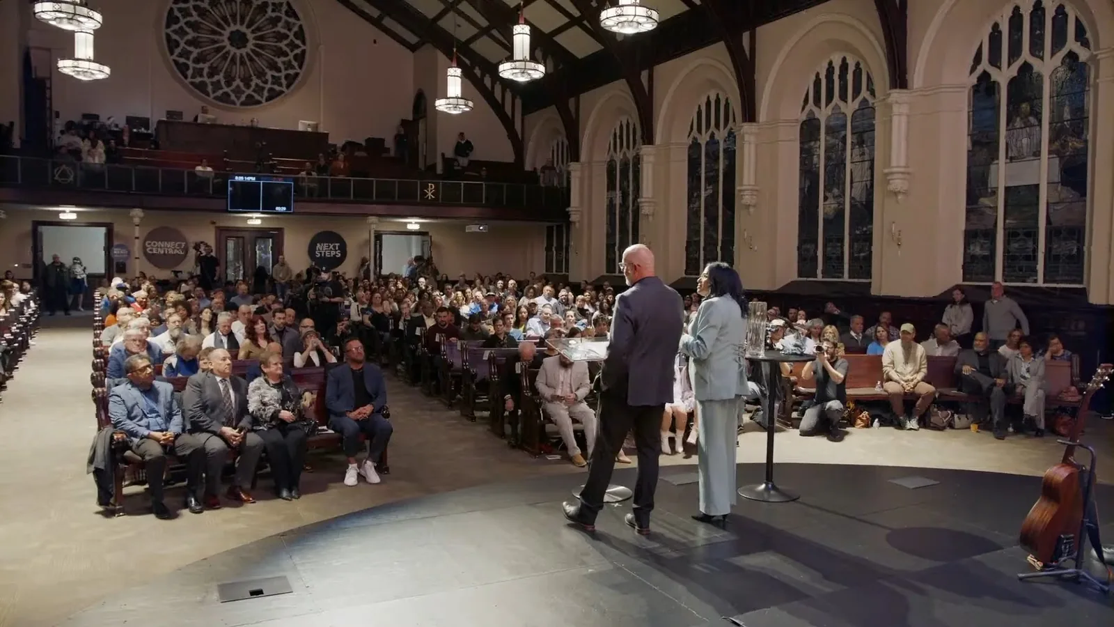 The view from the stage looking back at the congregation, the balcony and the rose window