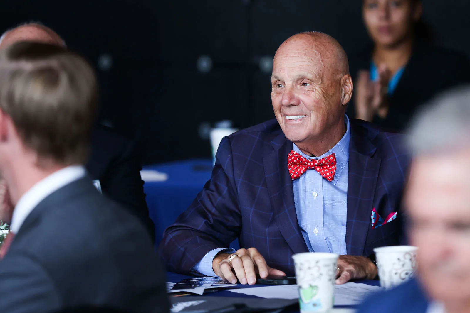 Tony Iannelli, President and CEO of the Greater Lehigh Valley Chamber of Commerce, smiling at his table during the forum