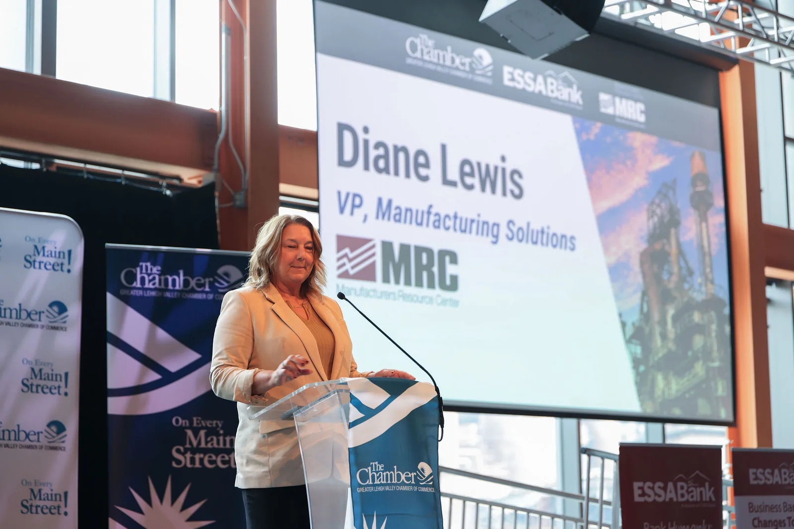 Diane Lewis, VP of Manufacturing Solutions at MRC, at the podium