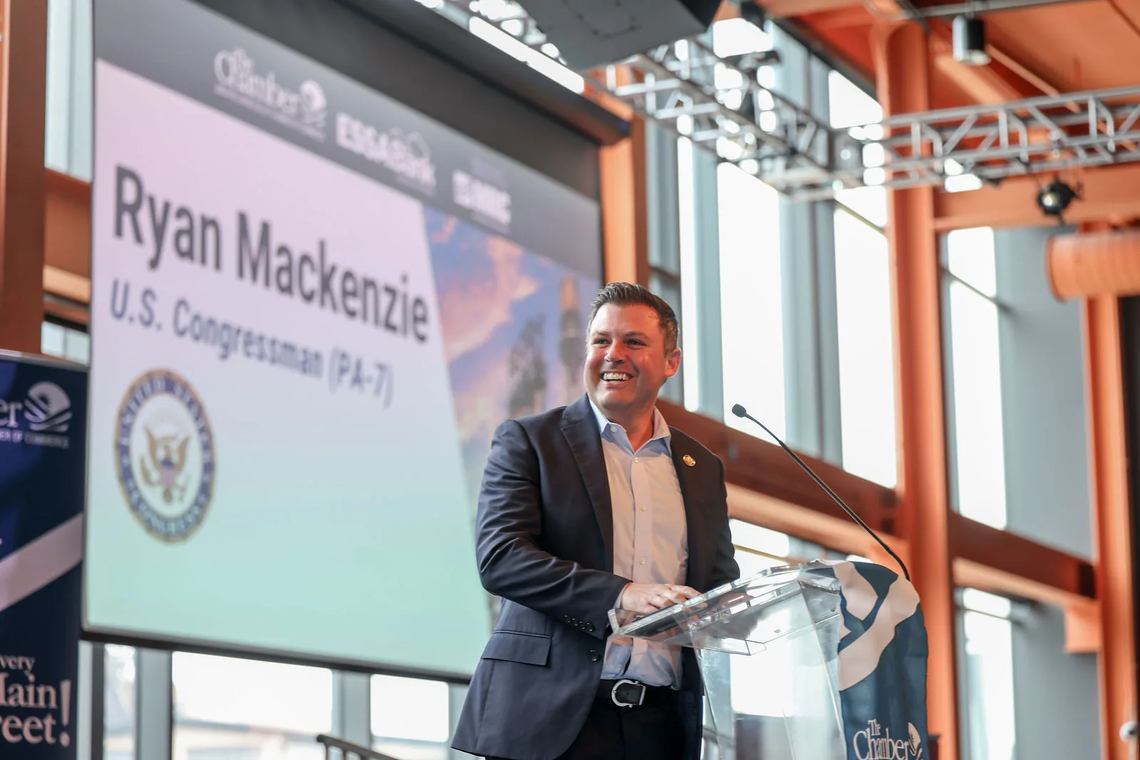 U.S. Congressman Ryan Mackenzie speaking at the podium