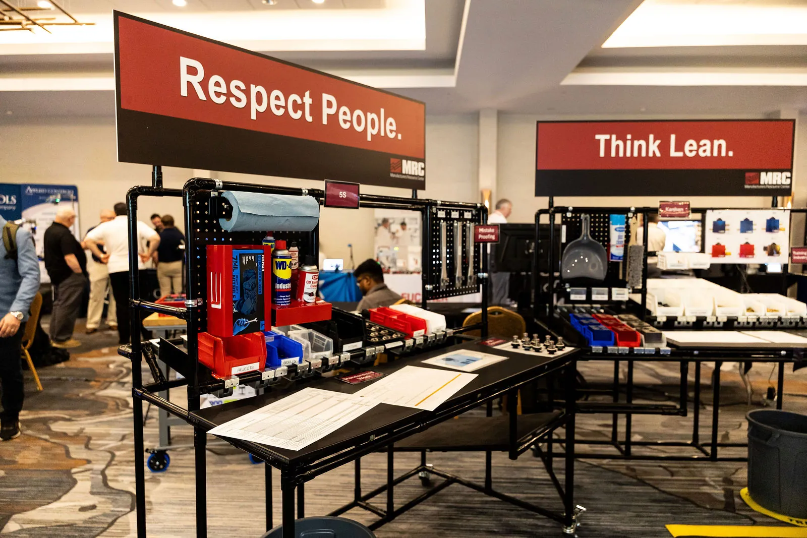 MRC's lean lab with workstations under signs reading Respect People and Think Lean