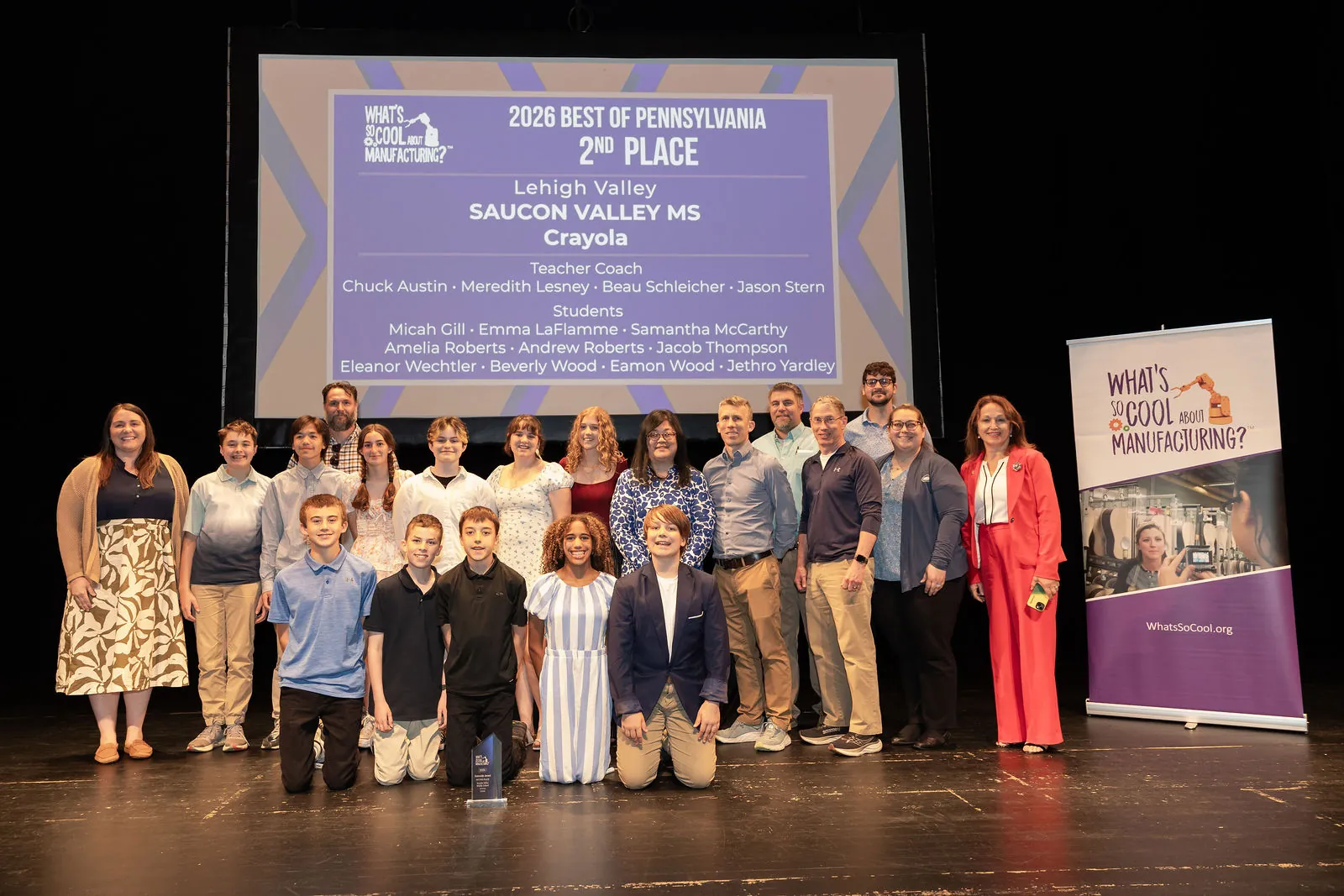 The Saucon Valley Middle School team on stage in front of the second place slide