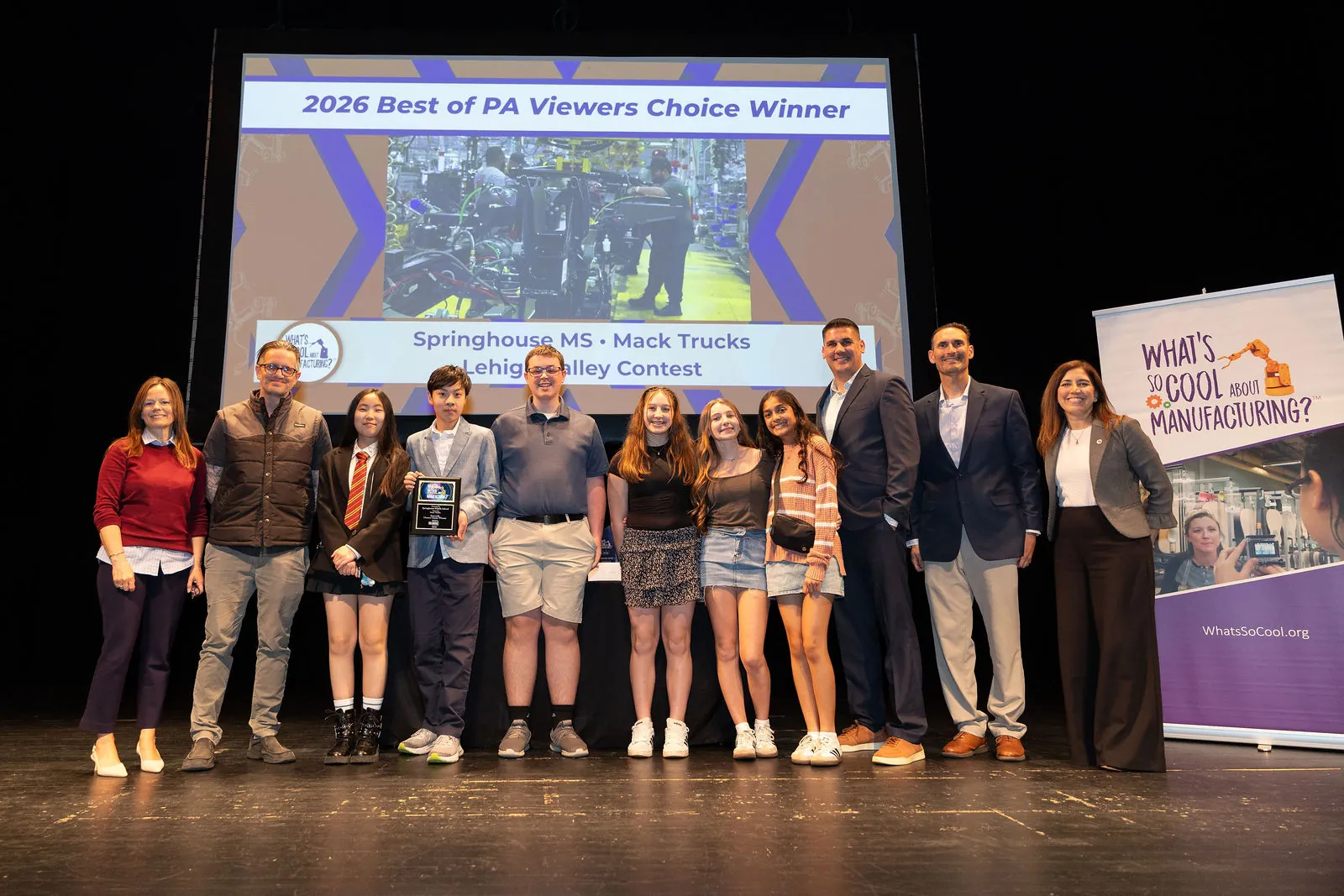 The Springhouse Middle School team on stage in front of the Best of PA Viewers' Choice slide